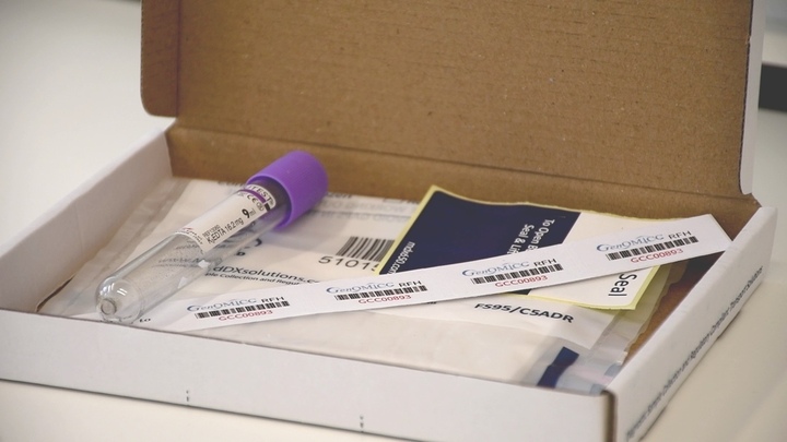 Picture of a specimen kit with a blood tube and patient identification labels